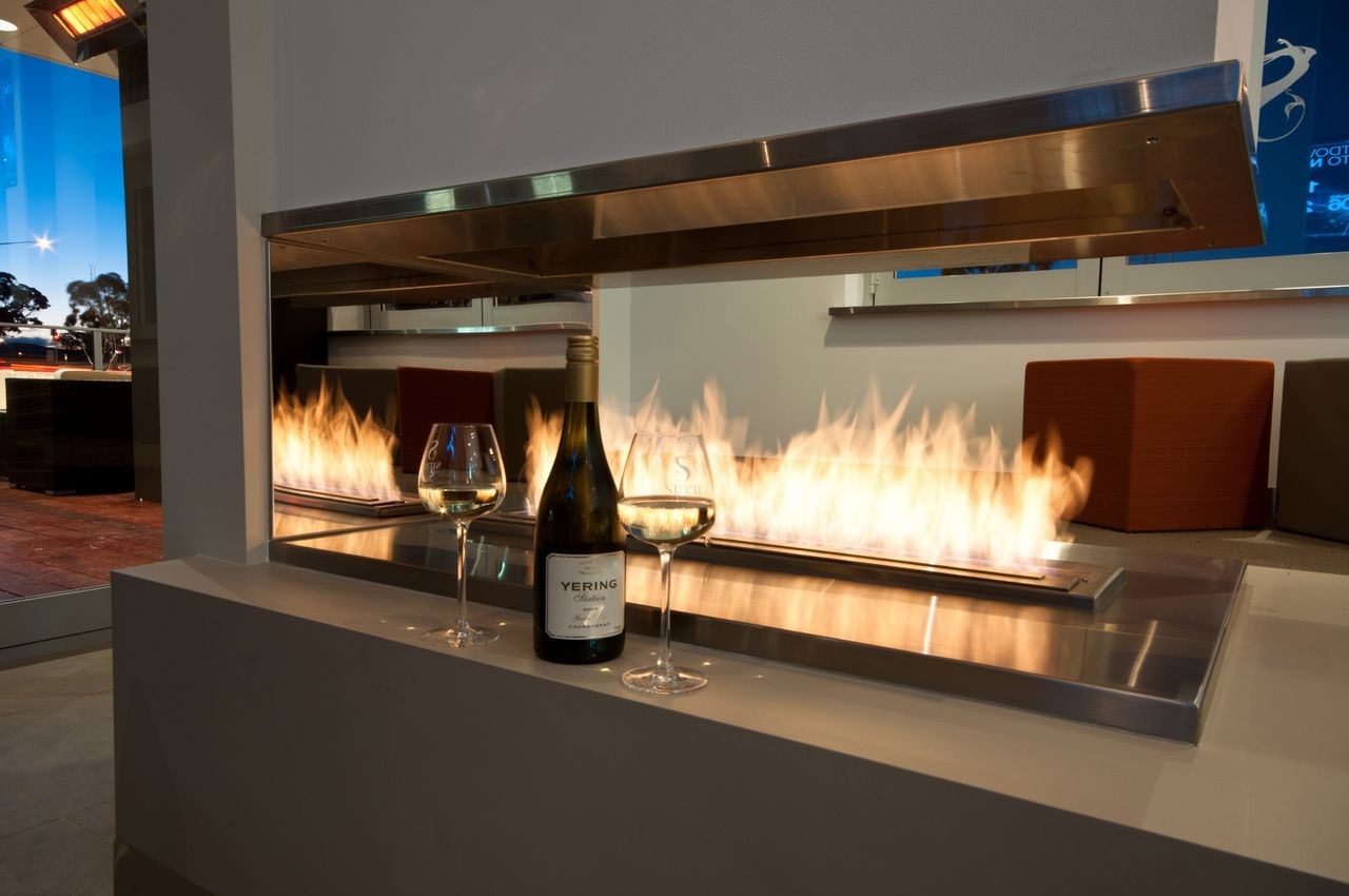 Llama de bioetanol ecosmartfire XL con marco de acero inoxidable y acabado elegante, ideal para decoración moderna y ambiente cálido.