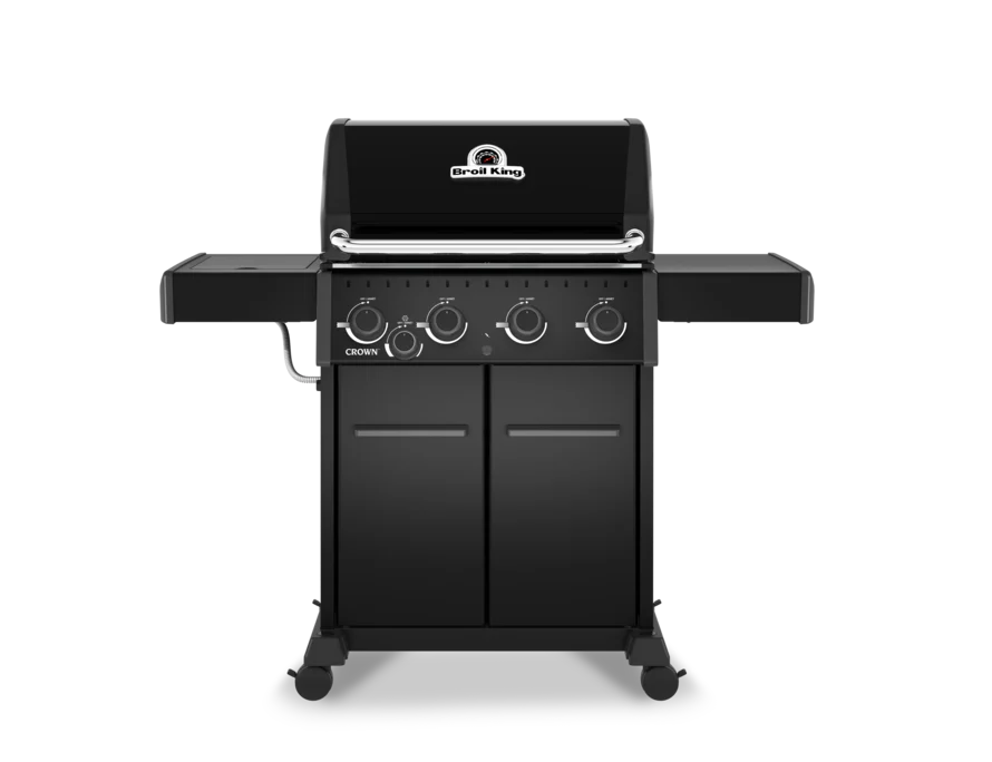 Barbacoa de gas Broil King Crown 440 Shadow en color negro mate, vista frontal con 4 quemadores y estantes laterales