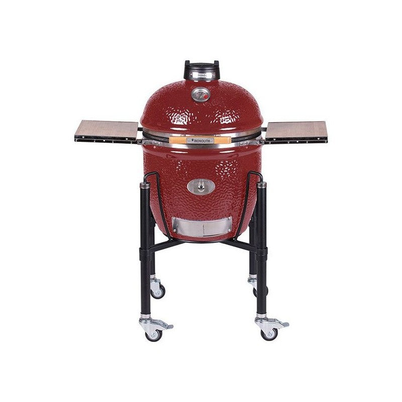 Kamado Monolith Classic burdeos integrado en una terraza, ideal para asados y ahumados al aire libre.